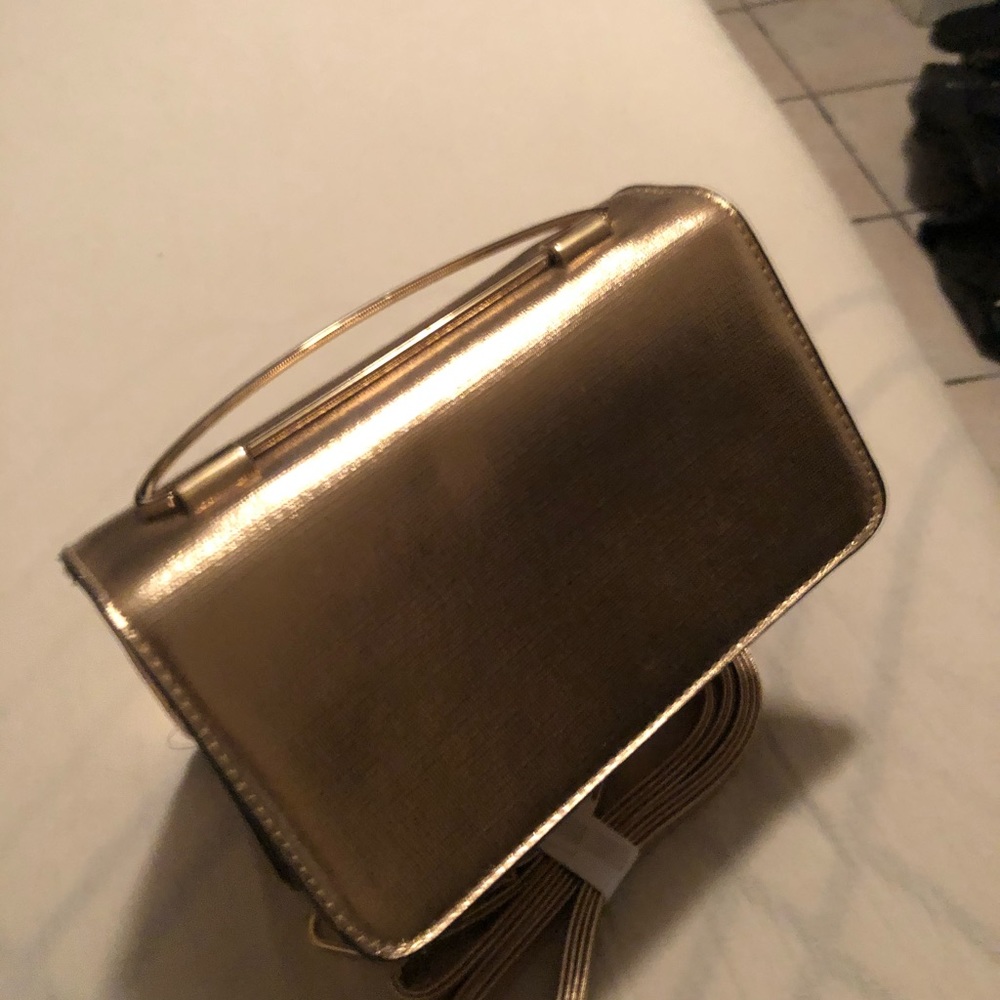 Women’s gold crossbody handbag